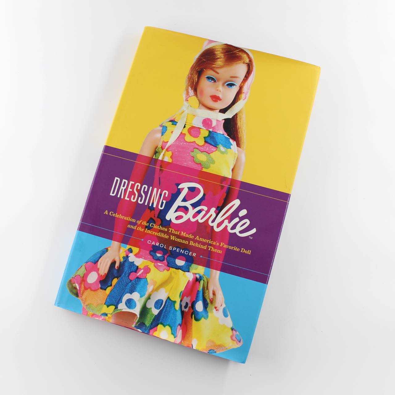 Dressing Barbie: A Celebration of the Clothes That Made America’s Favorite Doll and the Incredible Woman Behind Them book by Carol Spencer   ISBN: 9780062802446